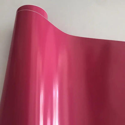 Pellicola wrap rosa lucida per tuning auto Da300Cavalli, rotolo su sfondo neutro.